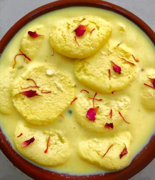 Kesar(saffron) Rasmalai close-up Indian sweet dish